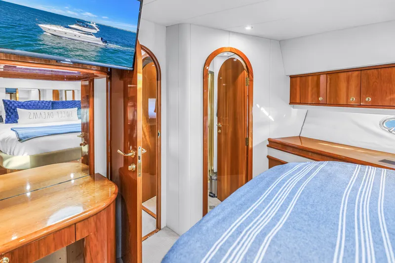 Slide: The Image of Luxurious interior of 2001 Neptunus 56 Flybridge yacht with elegant wood finishes. - 73