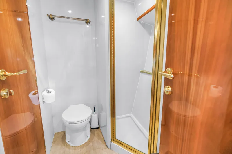 Slide: The Image of Luxurious bathroom on 2001 Neptunus 56 Flybridge yacht with shower and toilet. - 77