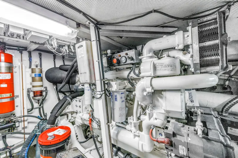 Slide: The Image of Engine room of a 2001 Neptunus 56 Flybridge yacht, showcasing mechanical components. - 80