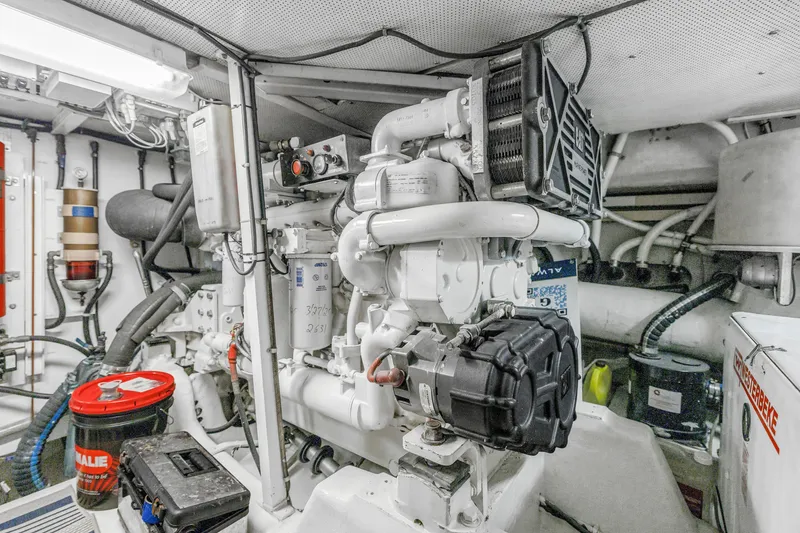 Slide: The Image of Engine room of 2001 Neptunus 56 Flybridge yacht, showcasing mechanical components and equipment. - 81