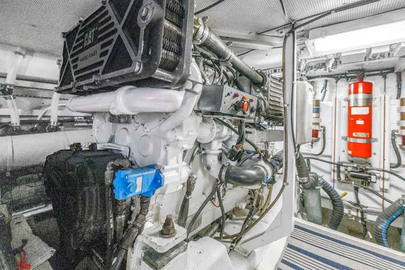 Slide: The Image of Engine room of 2001 Neptunus 56 Flybridge yacht, featuring marine power systems. - 82