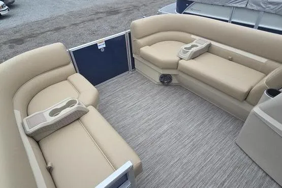 Slide: The Image of Interior of 2026 Godfrey Xperience 2286 pontoon boat with beige seating and cup holders. - 7