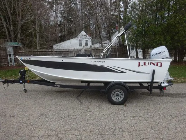 The Image of 2020 Lund 1775 Impact SS boat on trailer, side view. - 1