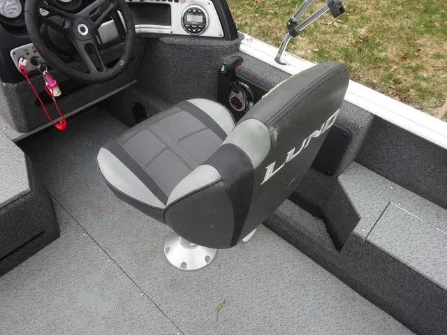 Slide: The Image of Interior of a 2020 Lund 1775 Impact SS boat with seat and controls. - 5