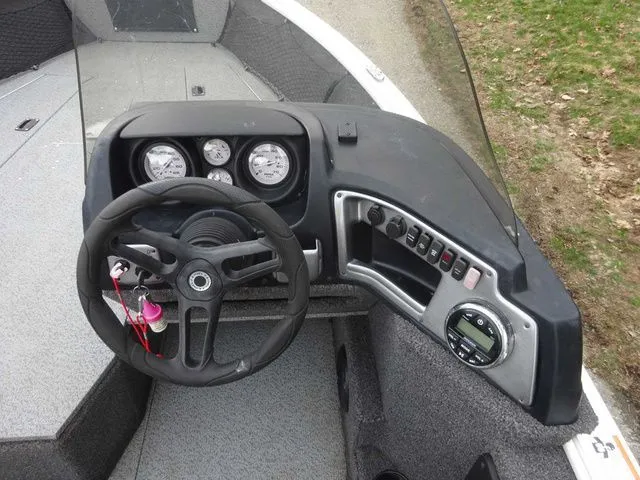 Slide: The Image of Interior view of a 2020 Lund 1775 Impact SS boat with steering console. - 9