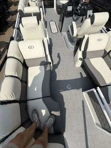 Slide: The Image of 2026 Veranda Vr235rcp pontoon boat interior with plush seating. - 16
