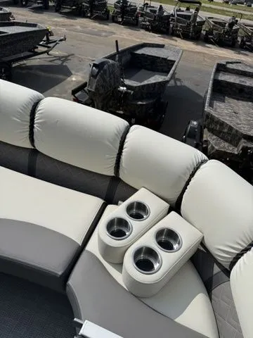 Slide: The Image of Interior of a 2026 Veranda Vr235rcp with comfortable seating and cup holders. - 23
