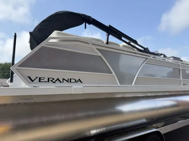 Slide: The Image of 2026 Veranda Vr235rcp pontoon boat under sunny sky. - 7