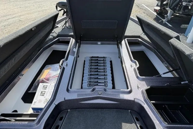 Slide: The Image of Open storage compartments in a 2026 Skeeter ZXE20 boat, showcasing organized interior layout. - 13