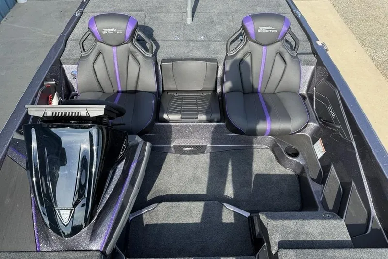 Slide: The Image of 2026 Skeeter ZXE20 boat interior with sleek black and purple seats. - 15