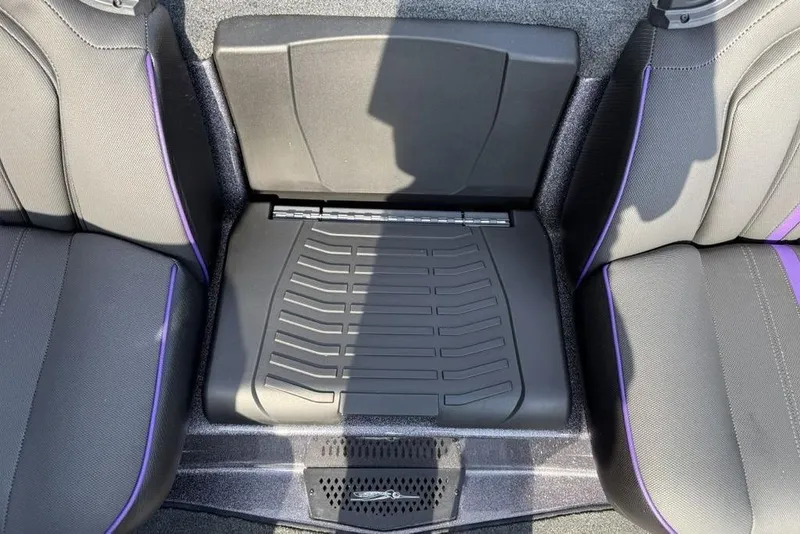 Slide: The Image of 2026 Skeeter ZXE20 interior seating with purple accents and storage compartment. - 20