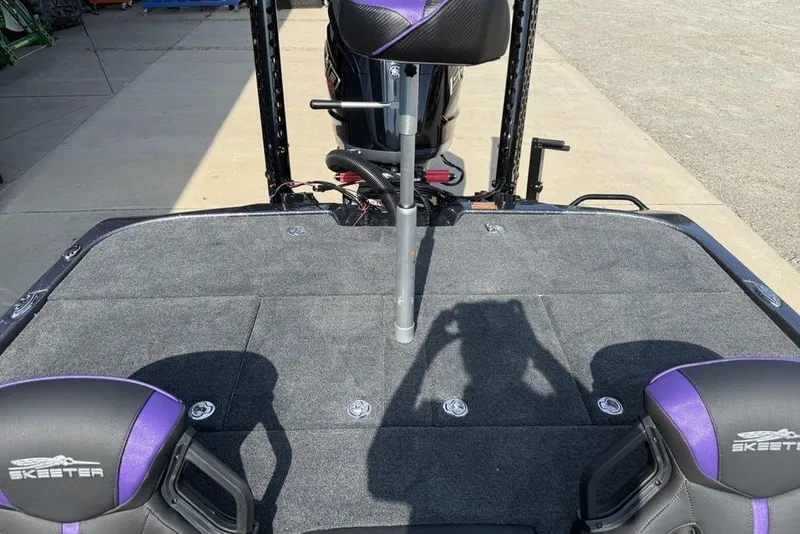 Slide: The Image of 2026 Skeeter ZXE20 boat deck with seats and fishing pole holder. - 21