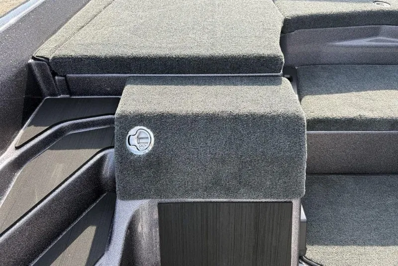 Slide: The Image of Interior view of 2026 Skeeter ZXE20 boat with carpeted surfaces and storage compartment. - 7