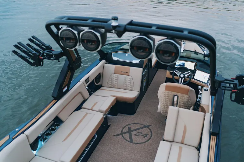 Slide: The Image of Manufacturer Provided Image: 2025 MasterCraft X24 boat interior with luxury seating and advanced audio system. - 17