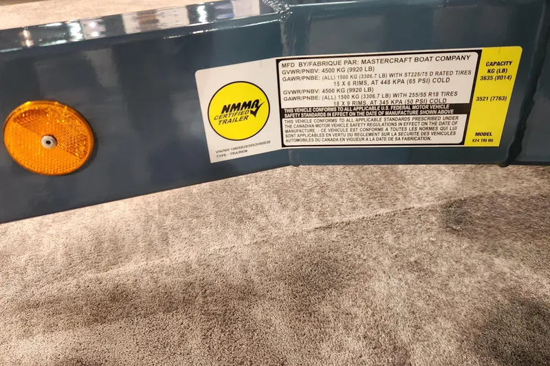 Slide: The Image of 2025 MasterCraft X24 trailer label with NMMA certification and weight specifications. - 21