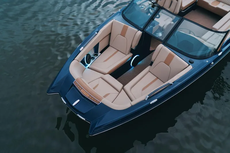 Slide: The Image of Manufacturer Provided Image: 2025 MasterCraft X24 boat with luxurious seating on calm water. - 8