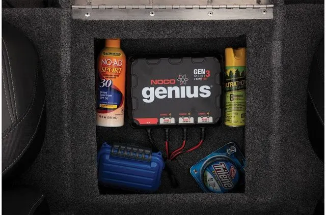 Slide: The Image of Storage compartment in Tracker Pro Team 190 TX with charger and accessories. - 28