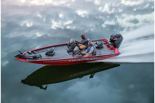 Slide: The Image of 2021 Tracker Pro Team 190 TX boat on calm water. - 6