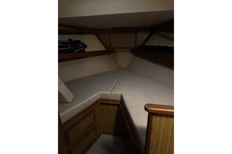 Slide: The Image of 1978 Viking 43 Aft Cabin interior with cozy V-berth and wooden accents. - 10