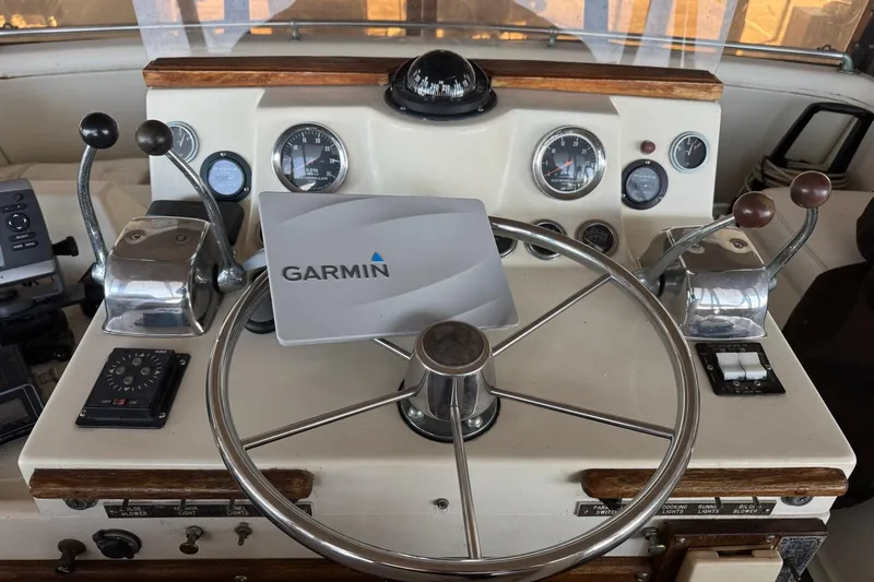 Slide: The Image of 1978 Viking 43 Aft Cabin helm with Garmin navigation, gauges, and controls. - 3