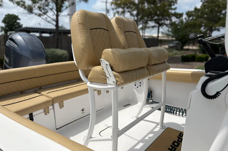 Slide: The Image of 2021 Sportsman Heritage 211 Center Console boat with tan seating and Yamaha engine. - 12