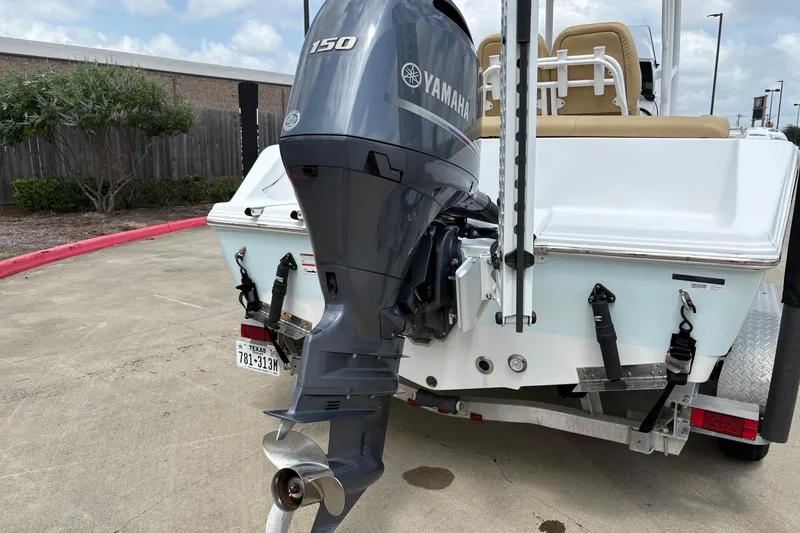 Slide: The Image of 2021 Sportsman Heritage 211 Center Console with Yamaha 150 engine on trailer. - 14