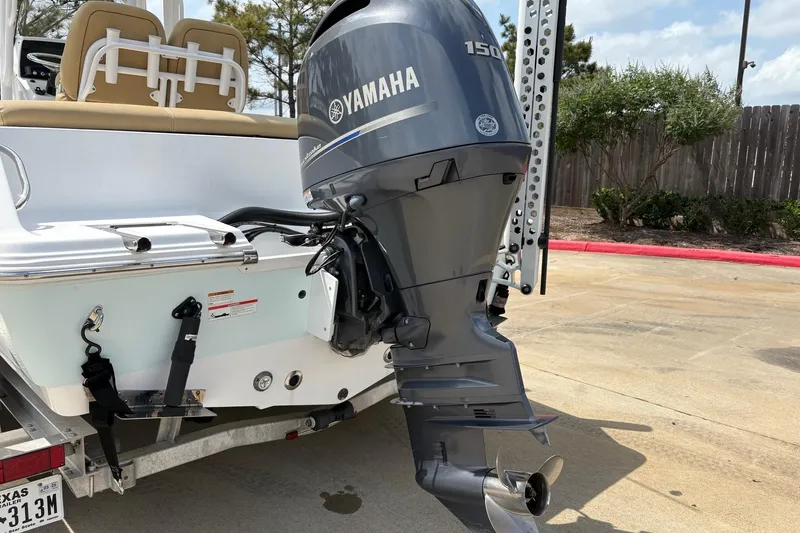 Slide: The Image of 2021 Sportsman Heritage 211 Center Console with Yamaha 150 outboard motor. - 15