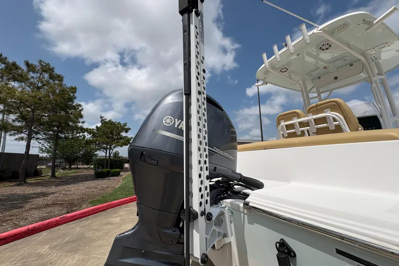 Slide: The Image of 2021 Sportsman Heritage 211 Center Console boat with Yamaha engine, outdoor setting. - 17