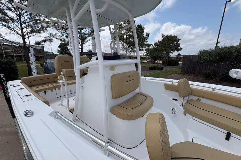 Slide: The Image of 2021 Sportsman Heritage 211 Center Console boat with tan seating and white deck. - 7
