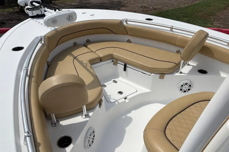Slide: The Image of 2021 Sportsman Heritage 211 Center Console boat with tan seating and white deck. - 8