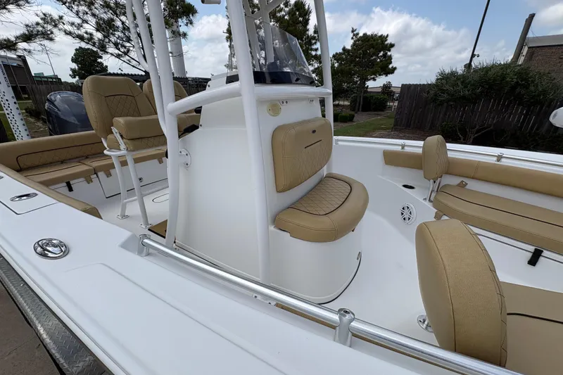 Slide: The Image of 2021 Sportsman Heritage 211 Center Console boat with tan seating and white deck. - 9