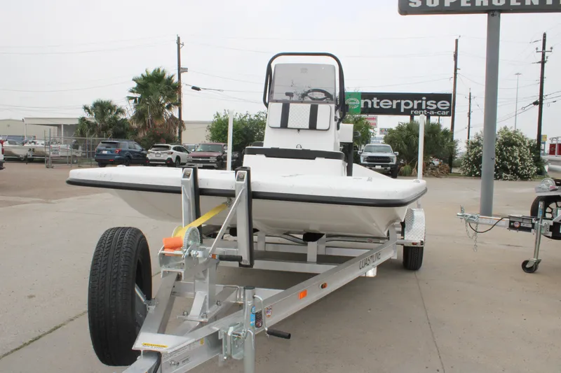 Slide: The Image of 2026 Freedom Boats 16' Eagle on trailer in parking lot. - 10