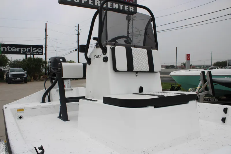 Slide: The Image of 2026 Freedom Boats 16' Eagle with Suzuki motor, displayed at a dealership. - 4