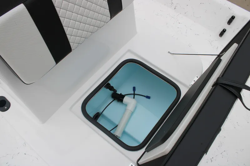Slide: The Image of 2026 Freedom Boats 16' Eagle interior storage compartment with plumbing components. - 6