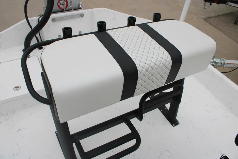 Slide: The Image of 2026 Freedom Boats 16' Eagle seat with black and white design, featuring rod holders. - 7