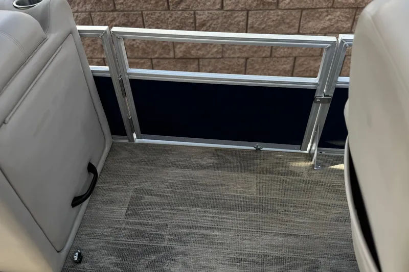 Slide: The Image of Interior view of 2024 Ranger Reata 223F boat, featuring seating and flooring details. - 15
