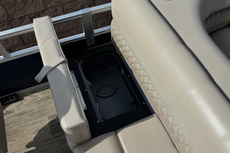 Slide: The Image of 2024 Ranger Reata 223F boat seat with storage compartment, featuring beige upholstery and quilted design. - 20