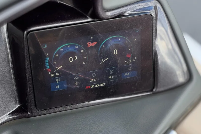 Slide: The Image of Digital dashboard of 2024 Ranger Reata 223F boat displaying speed, fuel, and temperature gauges. - 31