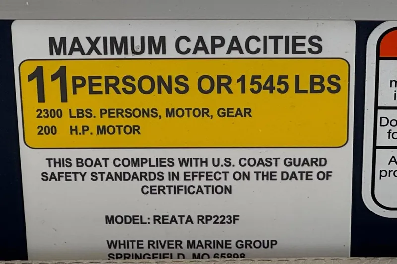 Slide: The Image of 2024 Ranger Reata 223F capacity label: 11 persons or 1545 lbs, 200 HP motor. - 36