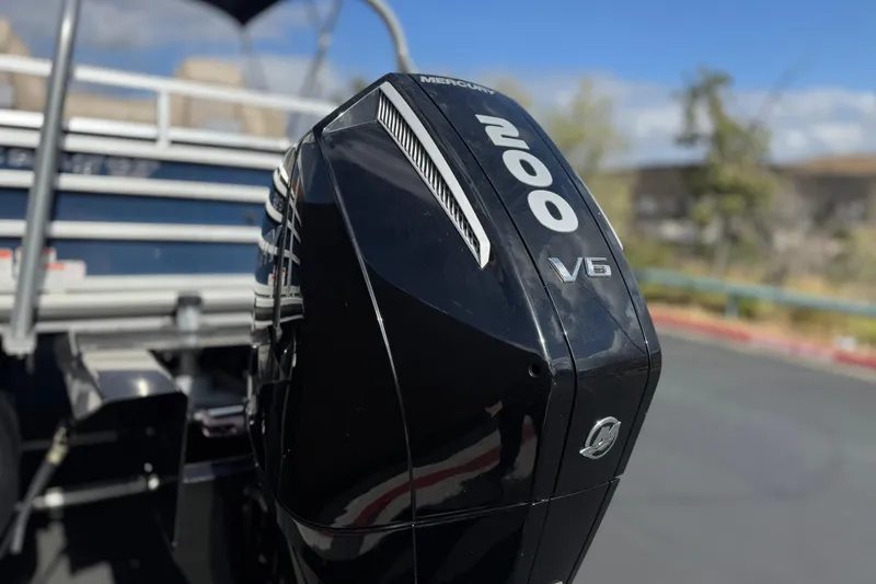 Slide: The Image of 2024 Ranger Reata 223F with Mercury 200 V6 outboard motor, close-up view. - 8