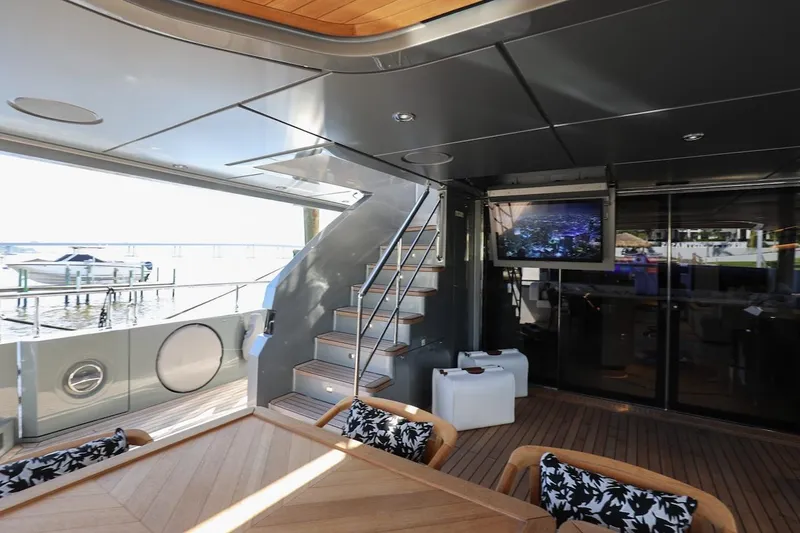 Slide: The Image of Luxurious 2025 Majesty 120 yacht interior with modern design and outdoor seating. - 33