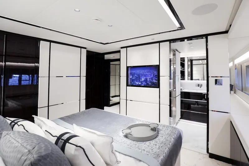 Slide: The Image of Luxurious interior of 2025 Majesty 120 yacht, featuring modern bedroom and ensuite bathroom. - 48