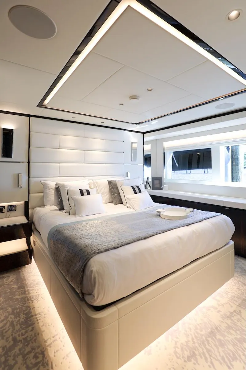 Slide: The Image of Luxurious bedroom interior on 2025 Majesty 120 yacht, featuring modern design and elegant furnishings. - 59