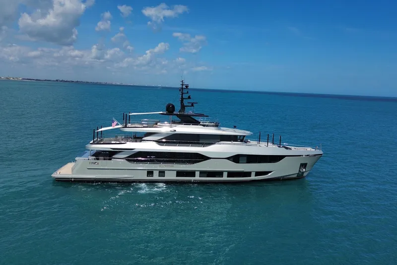 Slide: The Image of Luxurious 2025 Majesty 120 yacht cruising on clear blue ocean waters. - 6