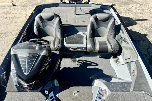 Slide: The Image of 2020 Ranger Z520L Cup-Equipped boat interior with dual seats and steering console. - 12