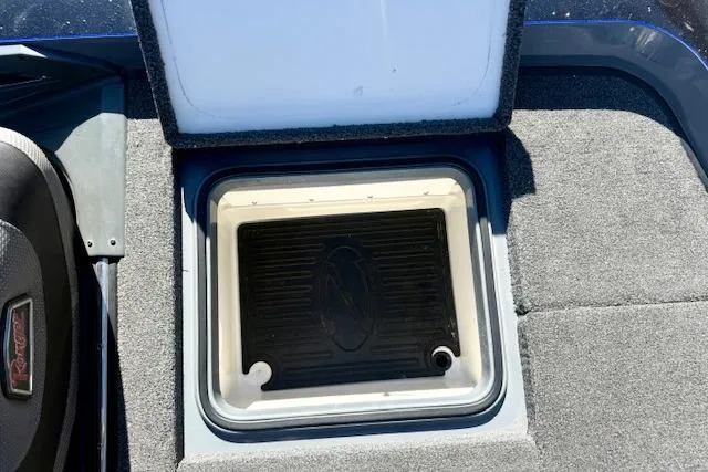 Slide: The Image of Open storage compartment on 2020 Ranger Z520L Cup-Equipped boat, featuring carpeted interior. - 5