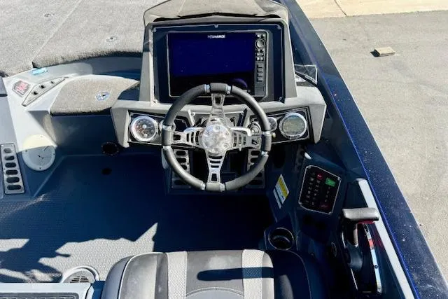 Slide: The Image of 2020 Ranger Z520L Cup-Equipped boat dashboard with steering wheel and electronic display. - 7