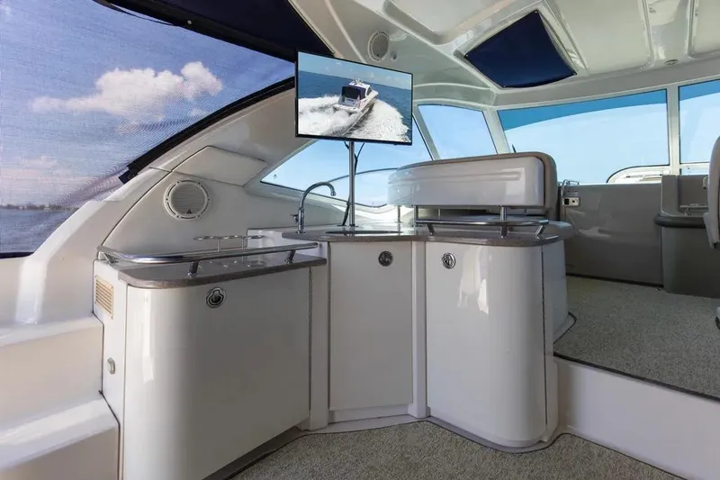 Slide: The Image of Luxurious interior of 2006 Sea Ray 48 Sundancer yacht with modern amenities and panoramic windows. - 10