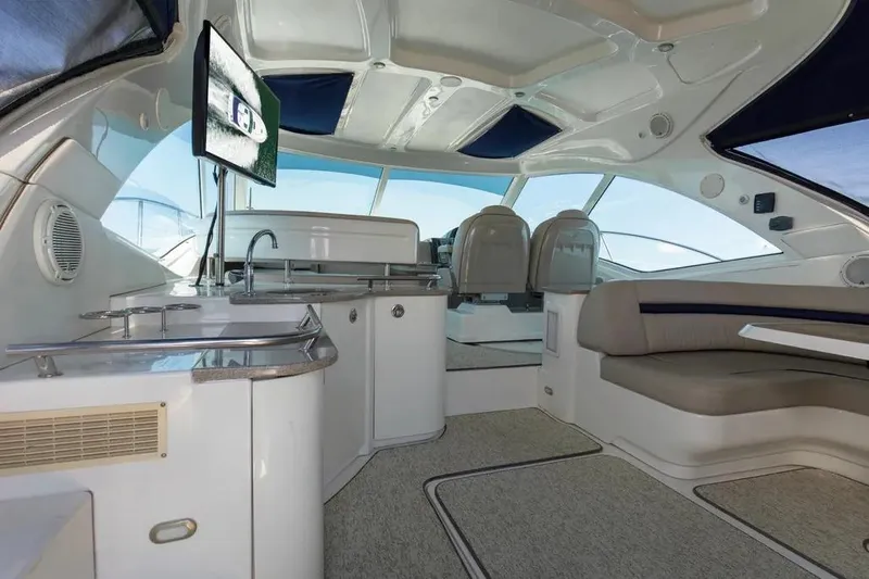 Slide: The Image of Luxurious interior of 2006 Sea Ray 48 Sundancer yacht with modern amenities and seating. - 12