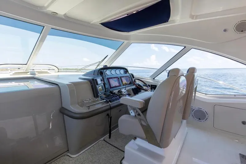 Slide: The Image of Interior helm of 2006 Sea Ray 48 Sundancer yacht with modern navigation equipment. - 14